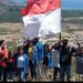 Pemerintah Desa Wewaria dan Mahasiswa Unflor Kibarkan Bendera di Puncak Bukit Watu Kota